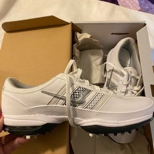 Women’s Nike golf shoes.  Never worn  8 1/2 wide shoes.